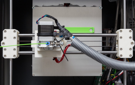 3d printer with bright green filament.の写真素材