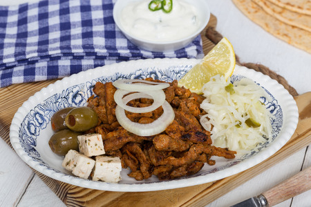 Gyros with Tzatziki Coleslaw olives and feta cheese.の写真素材