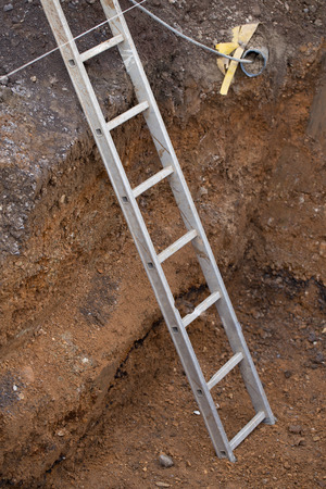 Conductor in the hole in the ground at a construction site.の写真素材