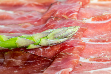 Green asparagus with ham macro.の写真素材