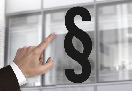 Hand pointing at paragraph sign concept.の写真素材