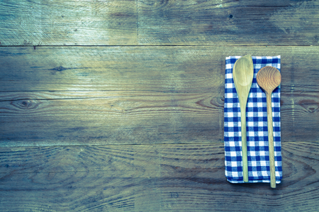 Kitchen towel wooden spoon on rustic wooden background.の写真素材