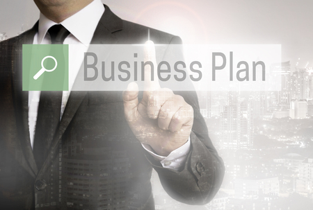 Business man with city background business plan browser.の写真素材