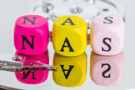 NAS letter cubes on harddisk concept.の写真素材