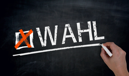 Wahl (in german Election) is written by hand on blackboard.の写真素材