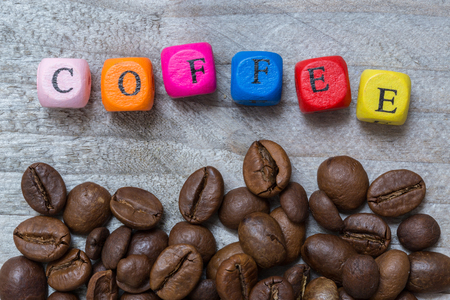 Coffee with letter cube concept against gray wood.の写真素材