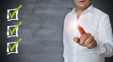 Checklist touchscreen is displayed by Man.の写真素材