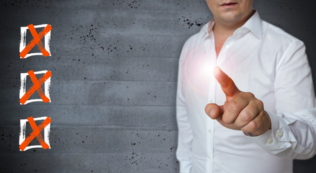 Checklist touchscreen is displayed by Man.の写真素材