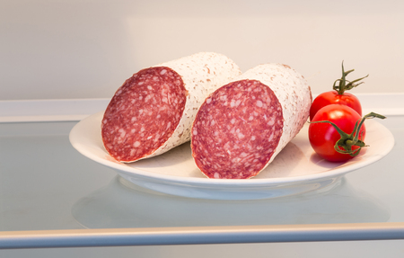 Salami in open refrigerator concept.の写真素材