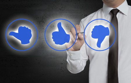 Rating symbols are painted by businessman on screen.の写真素材