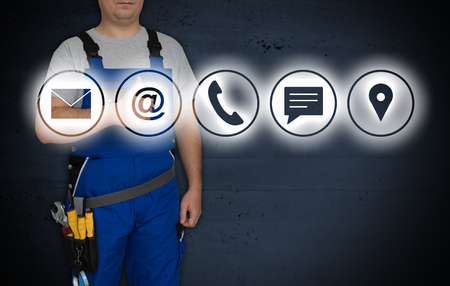 Contact options and craftsman with thumbs up.の写真素材