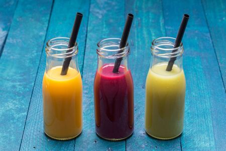 Smoothies various mango orange,  pomegranate, kiwi .の写真素材