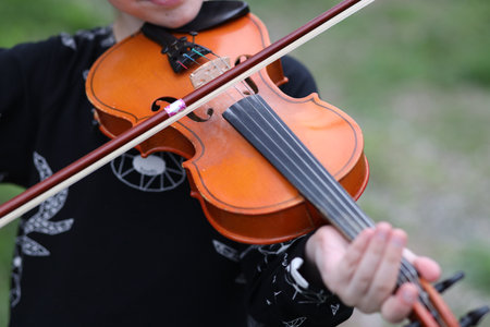 Hand on violin strings