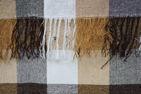 Wool blanket woven of different colors in a checkerboard pattern