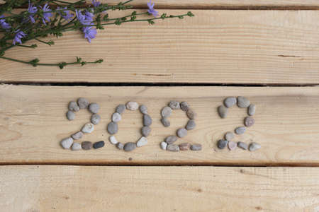 2022 logo, lined with sea stones 2022