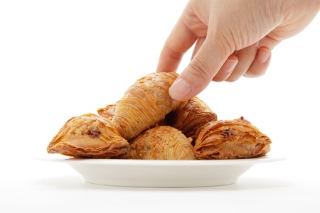 Female hand holding italian pastries Aragostineの写真素材