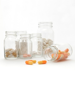 Pills spilling from the bottlesの写真素材
