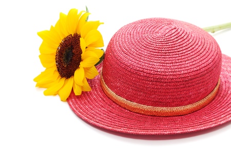 Red straw hat with sunflowerの写真素材