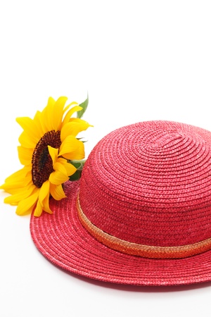 Red straw hat with sunflowerの写真素材