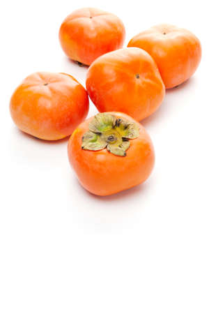 Persimmons on white backgroundの写真素材