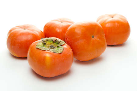 Persimmons on white backgroundの写真素材