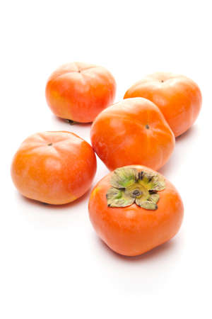 Japanese persimmons on white backgroundの写真素材