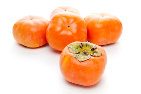 Japanese persimmons on white backgroundの写真素材
