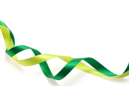 Green and yellow green ribbon on white backgroundの写真素材