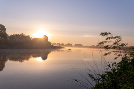 Sunrise on the river in the morning. Beautiful nature landscape.の写真素材