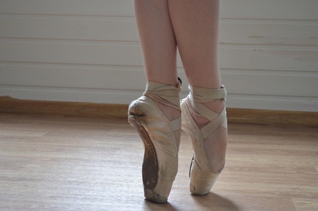 ballerina feet in ballet shoes - pointe