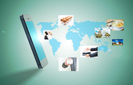 Modern communication technology with mobile phone and high tech backgroundの写真素材