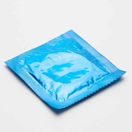 close up of a condom on white backgroundの写真素材