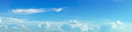 Panorama blue sky with fluffy clouds and sun lightの写真素材