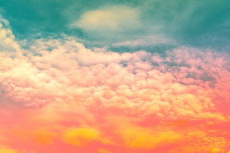 Abstract sky,orange and red color in soft clouds and green blue skyの写真素材