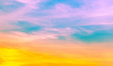pink and yellow orange color in soft clouds with blue green sky