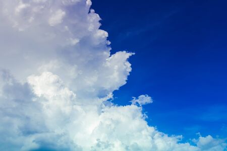 white bright cloudy in deep blue sky