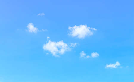 few floating on blue sky with sun light and wind