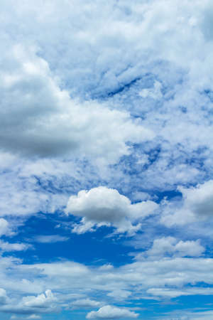 dim vertical blue sky with clouds