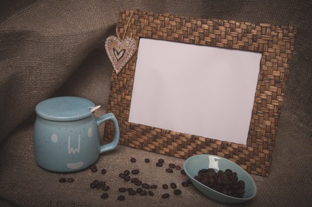 Desktop photo frame, coffee beans and sugar bowl on backgroundの写真素材