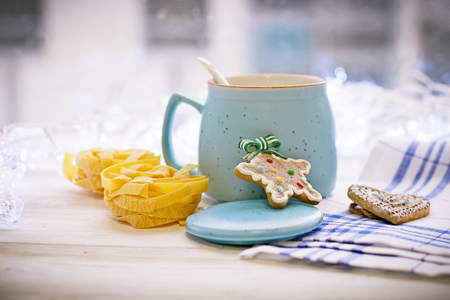 New Years still life with asugar bowl, spoon, cookies, pastaの写真素材