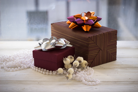 Colorful gift box wrapped in paper and christmas decorationの写真素材