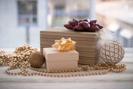 Colorful gift box wrapped in paper and christmas decorationの写真素材