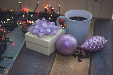 White gift box, blue cup, pink Christmas tree decorationsの写真素材