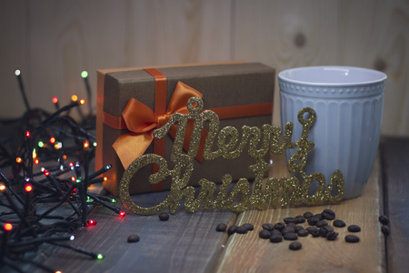 Brown gift box, inscription Marry Christmas blue cupの写真素材