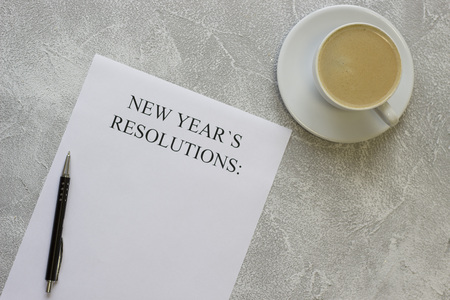 New Years resolutions paper,coffee with foamの写真素材