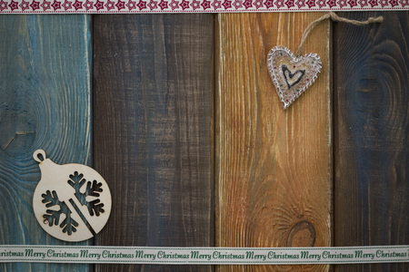 Christmas wooden background with ribbons, toys and coffee cupの写真素材