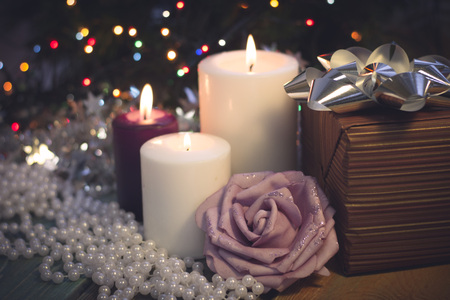 Still life with burning candles, Christmas decorations and a gift boxの写真素材