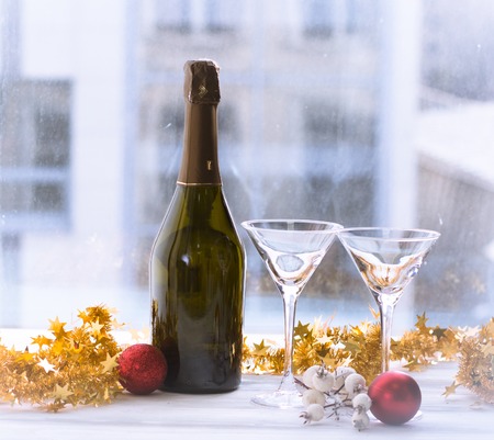 Two filled glasses and a bottleの写真素材