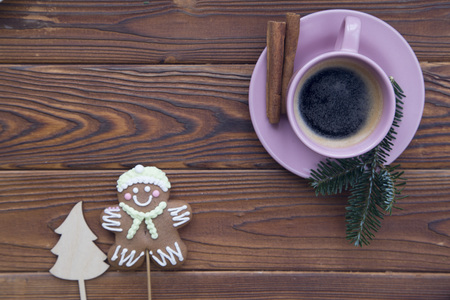 Christmas rustic wooden background with fir tree branches and coffeeの写真素材