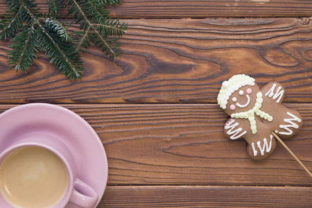 Christmas rustic wooden background with fir tree branches and coffeeの写真素材